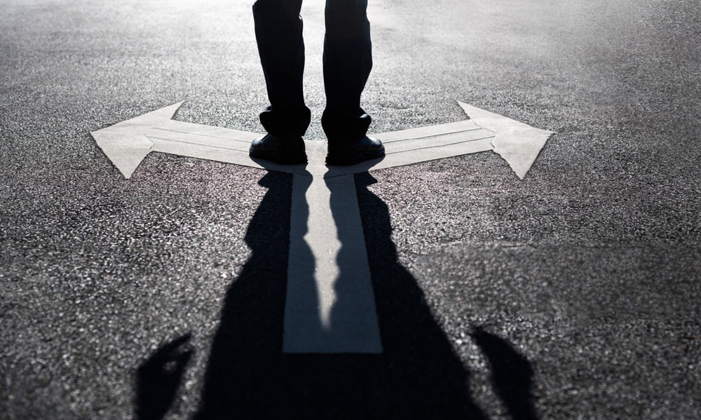 Businessman,Standing,On,Road,With,Two,Direction,Arrow,And,Get - Vege ...